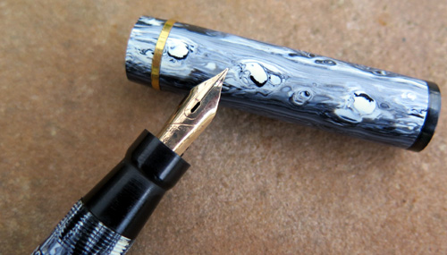 AN OLD ROYAL FOUNTAAIN PEN THAT HAS BEEN OUTFITTED WITH AN EVERSHARP SKYLINE NIB THAT HAS BEEN RE-GROND BY MIKE MASUYAMA (MIKE IT WORK) TO MAKE IT INTO A WET NOODLE WITH AN ACCOUNTANT WIDTH (THAT'S SUPER FINE)